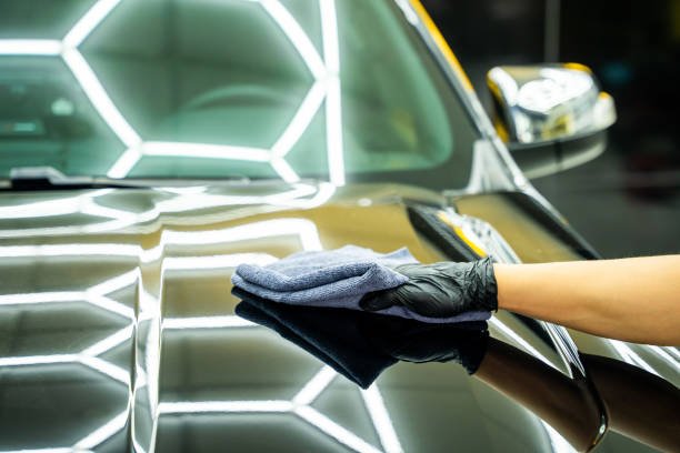 Man's hand is taking care of car maintenance at garage